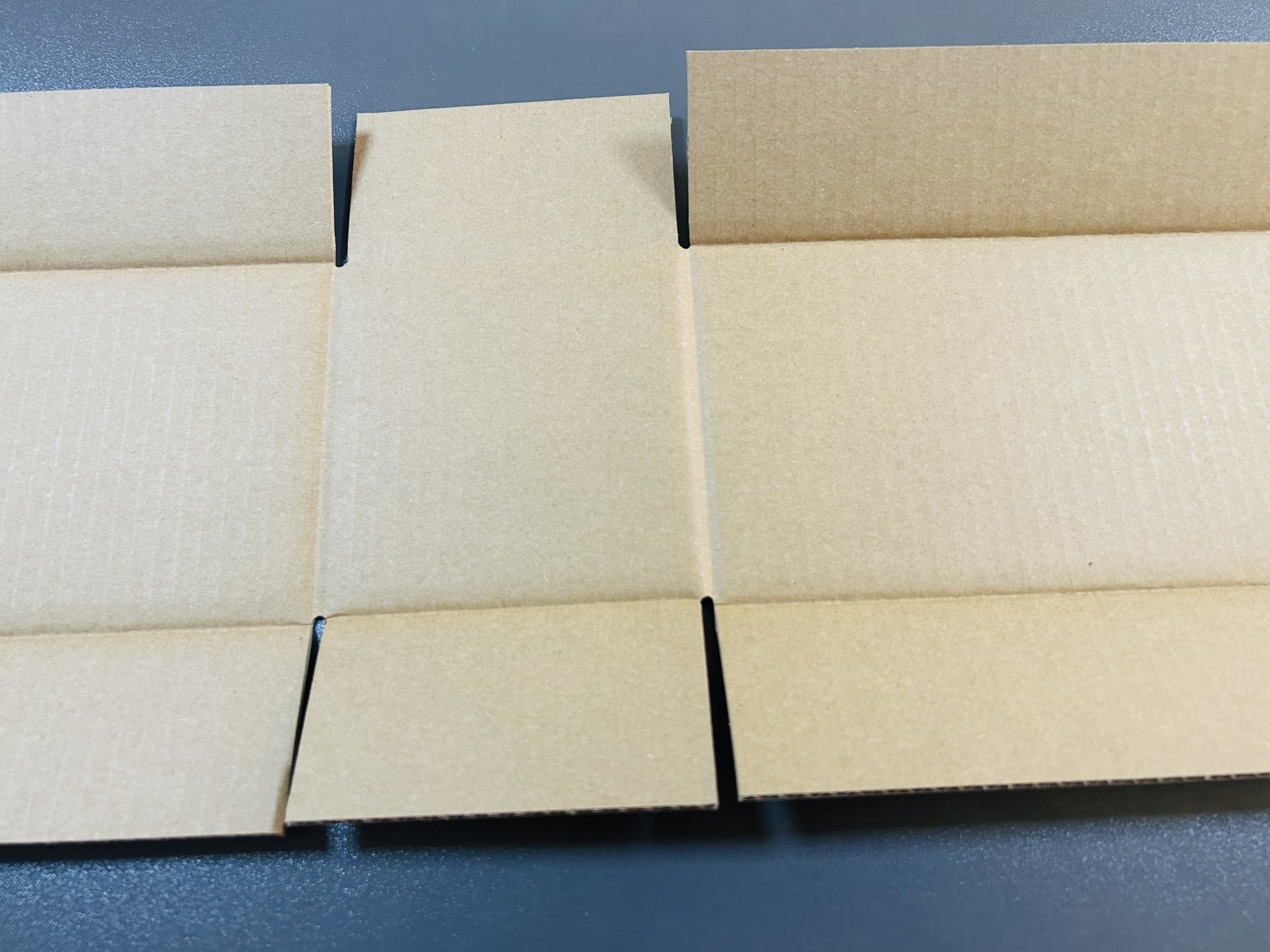 Corrugated box folding demonstration showing clean creases