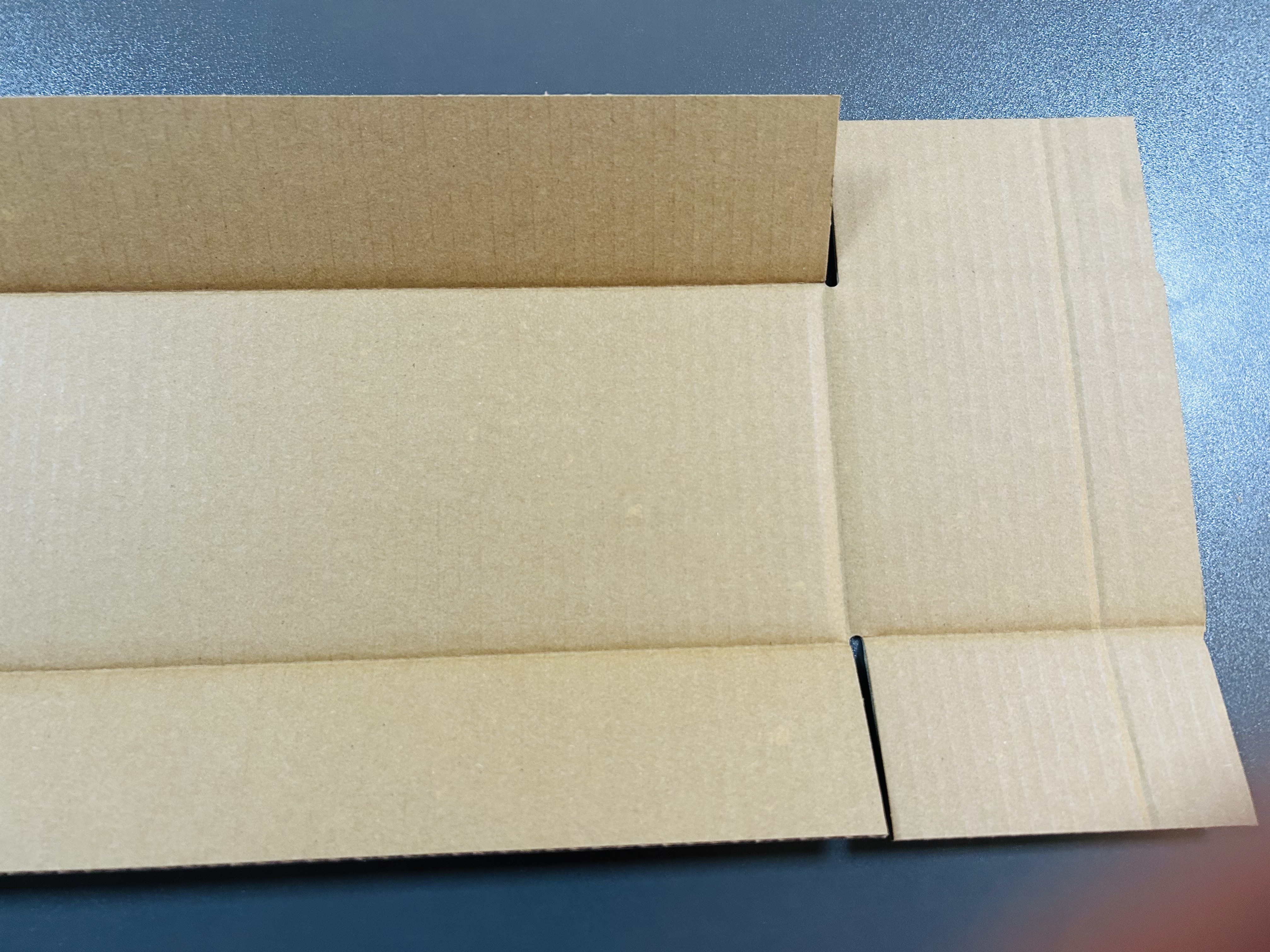 Corrugated box flat layout showing precision cutting